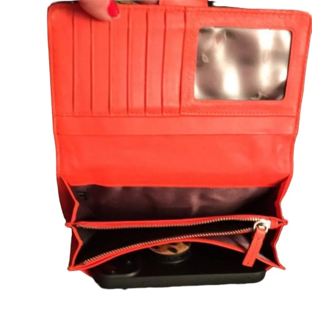 Milly wristlet orange mobile wallet front snap ,zip  lots of pockets